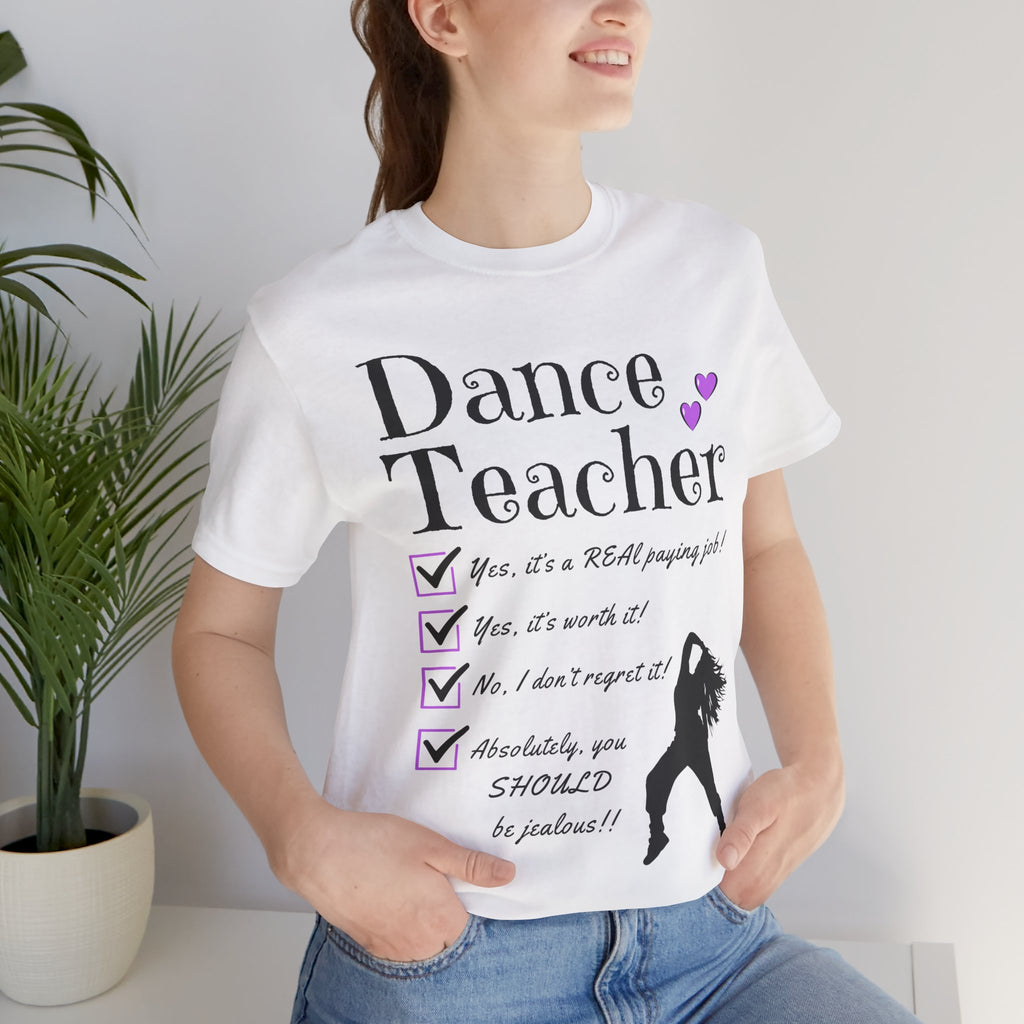 Woman wearing a white short-sleeve graphic t-shirt featuring the text Dance Teacher with a jazz, hip hop dancer silhouette.