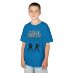 Young boy wearing a youth Gildan 5000B heavy cotton t-shirt in sapphire with a Field Hockey text and graphic
