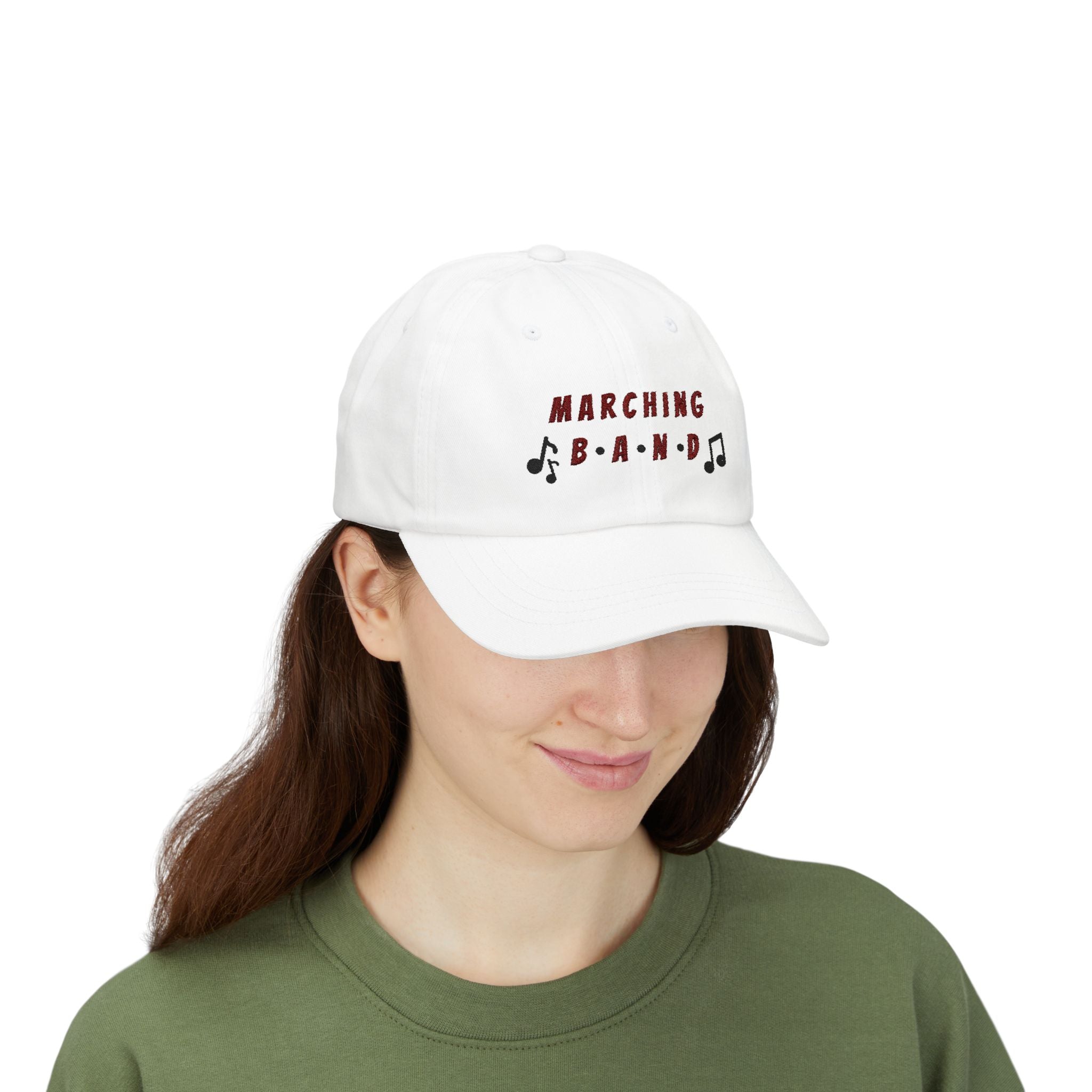 Woman wearing a white embroidered classic dad cap hat with a Marching Band text and musical note graphic 