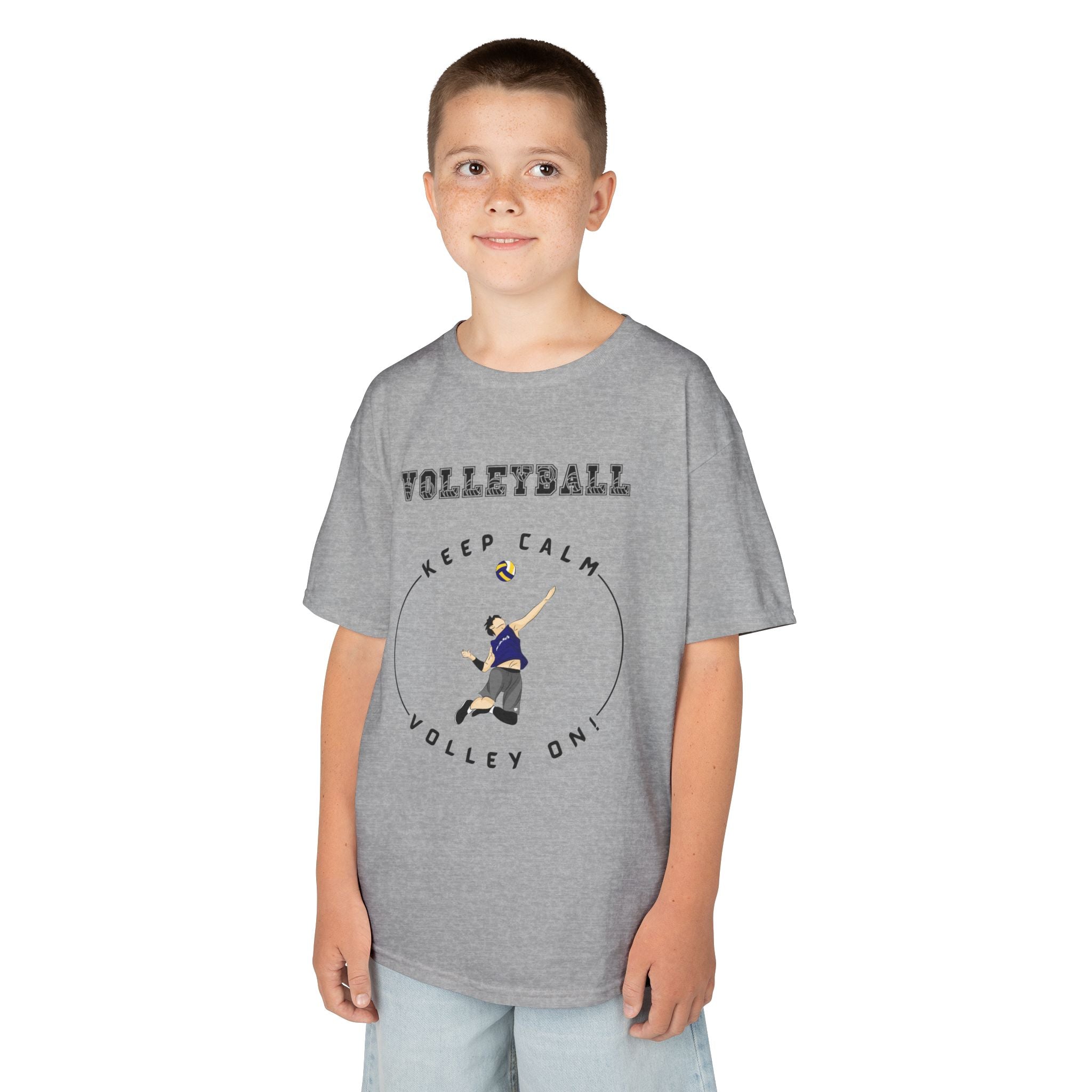 Young boy wearing a youth Gildan 5000B heavy cotton t-shirt in sport grey showing a boy playing Volleyball