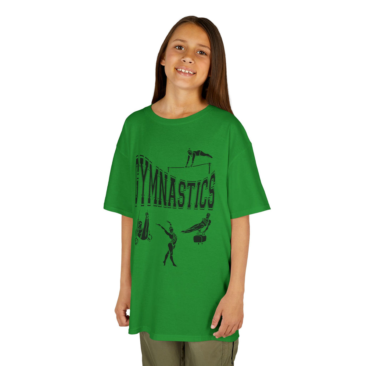 Young girl wearing a youth Gildan 5000B heavy cotton t-shirt in irish green with a gymnastics text and graphic