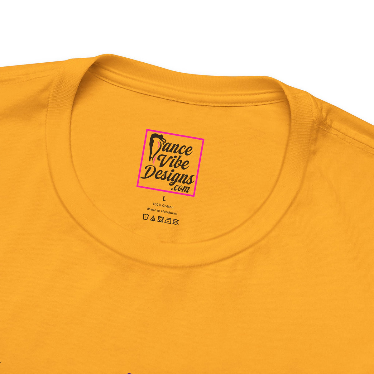 Close up view of a custom Dance Vibe Designs neck label shown over the t-shirt care instructions.