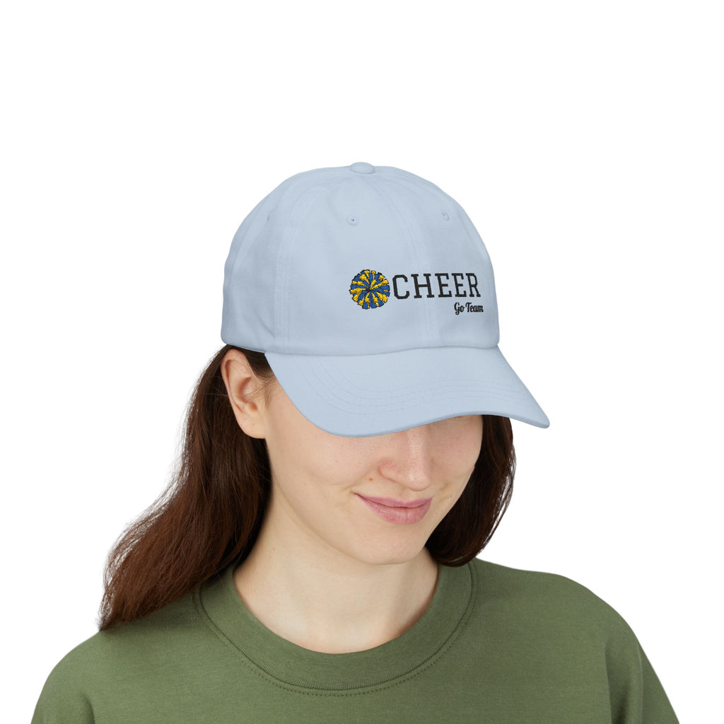 Woman wearing a light blue embroidered classic dad cap hat with a Cheer text and graphic