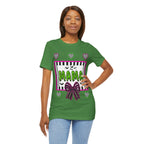 A woman wearing a green t-shirt featuring a colorful Beetlejuice inspired Halloween-themed graphic with MAMA on the front.