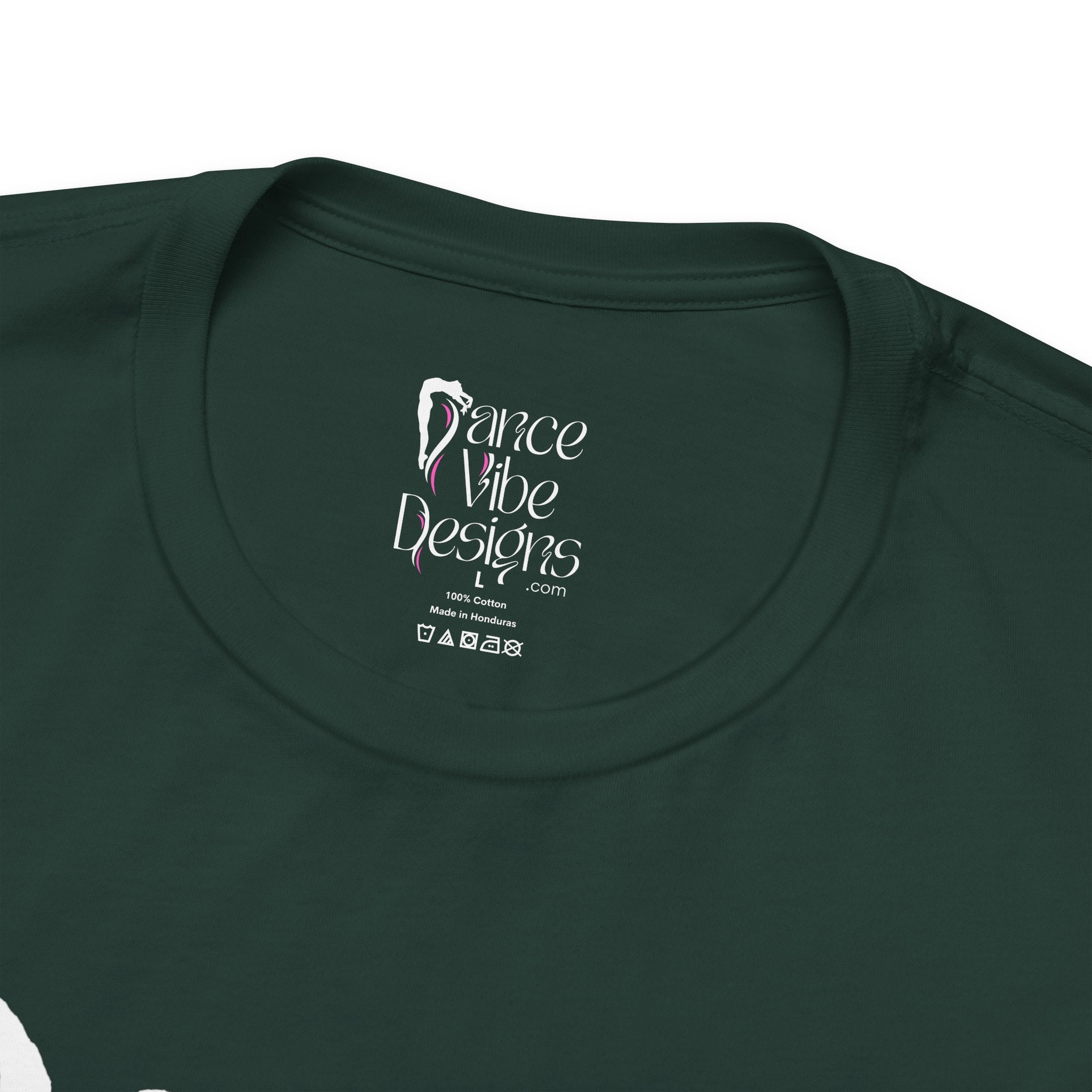 Close-up of a crewneck t-shirt showing the inner neck label with the brand Dance Vibe Designs printed above the care instructions.