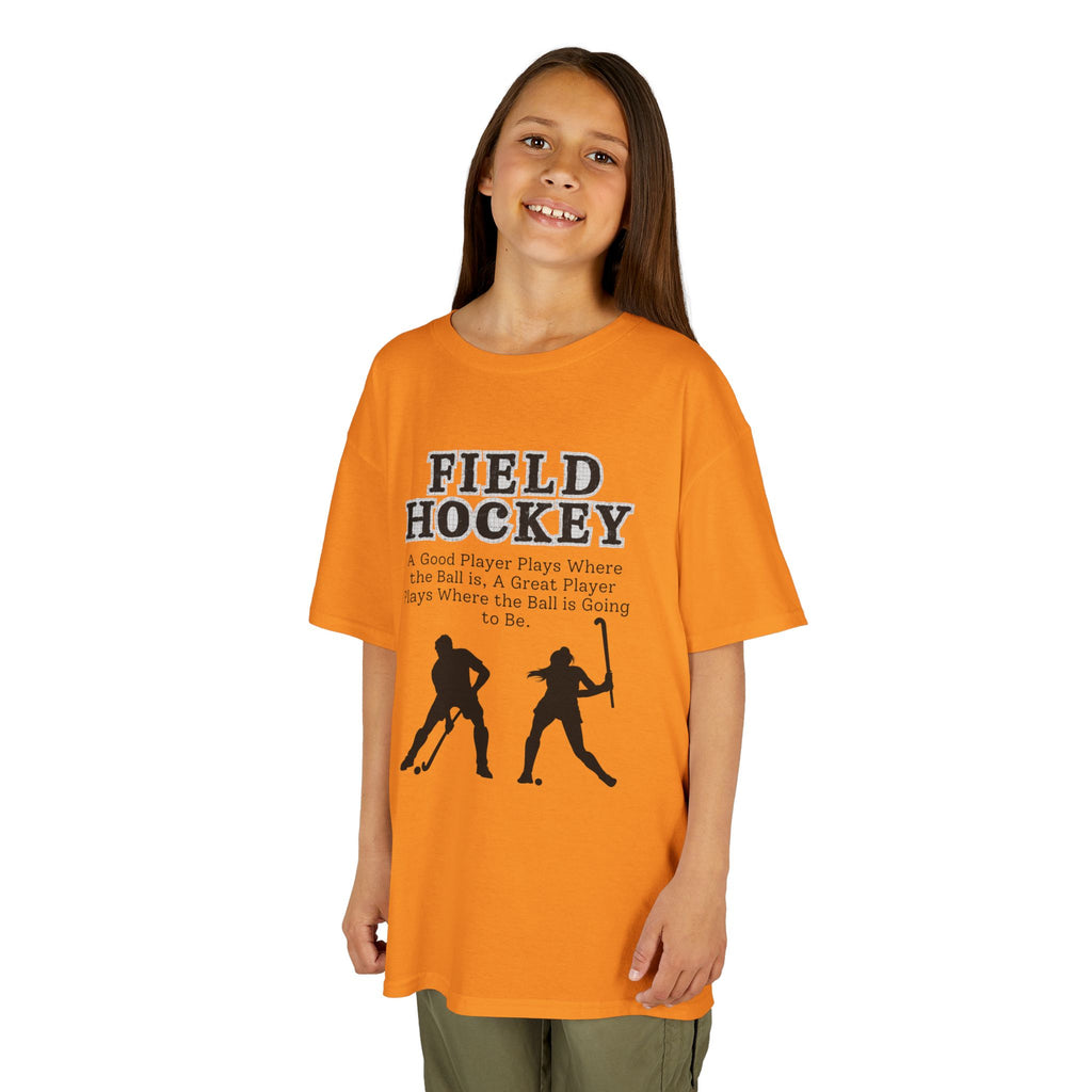 Young girl wearing a youth Gildan 5000B heavy cotton t-shirt in tennessee orange with a Field Hockey text and graphic