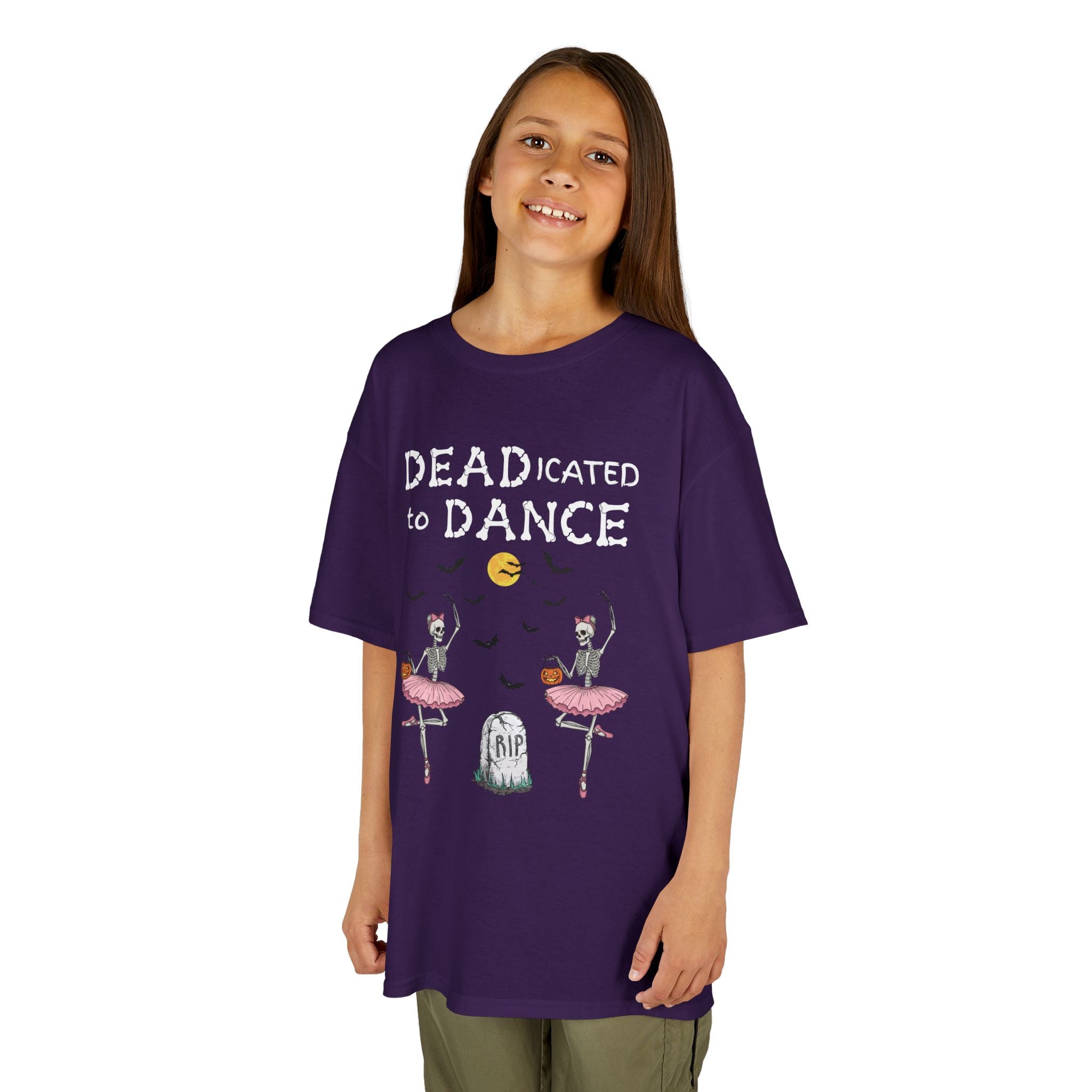 Young girl wearing a youth Gildan 5000B heavy cotton t-shirt in purple with a Deadicated to Dance Halloween theme