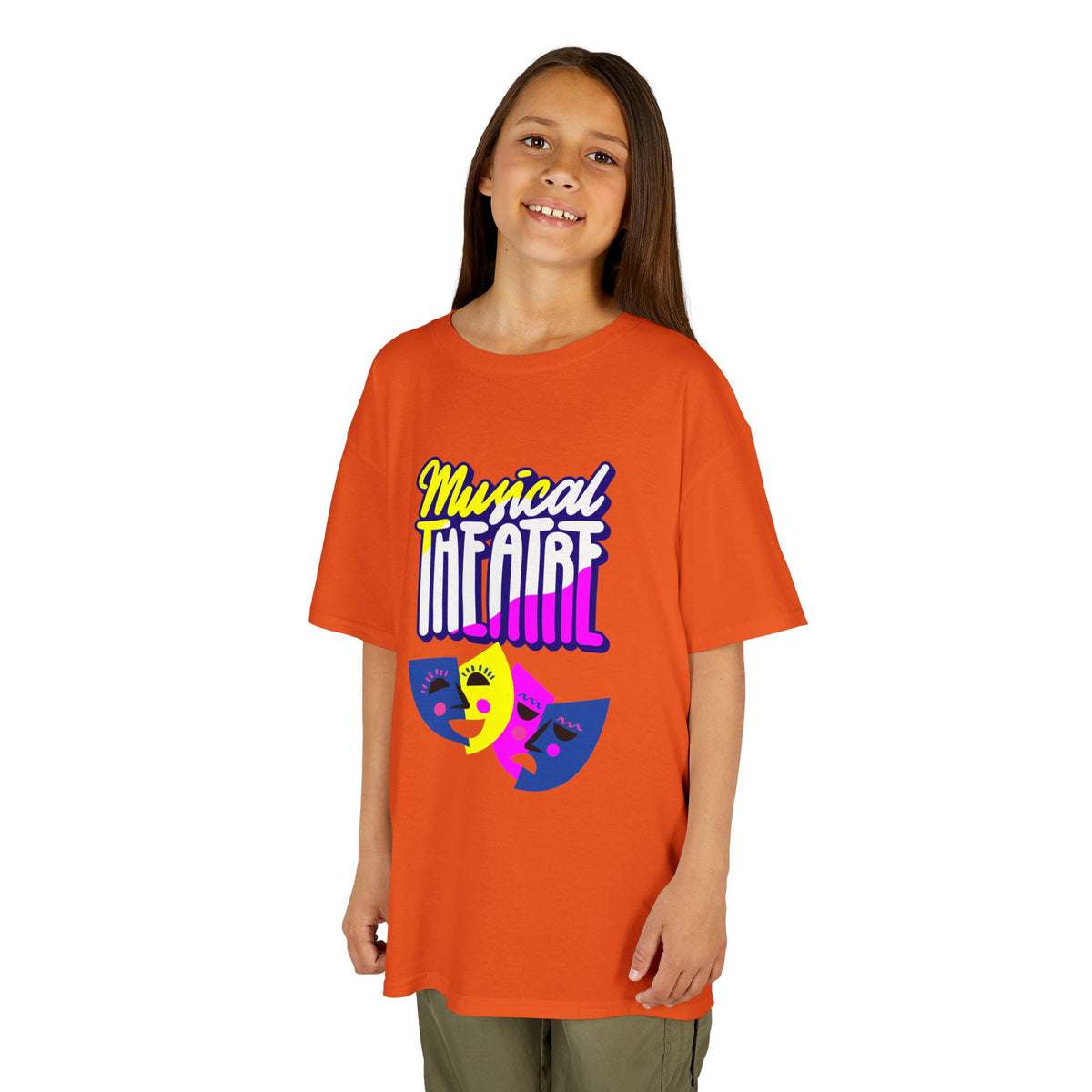 Young girl wearing a youth Gildan 5000B heavy cotton t-shirt in orange with a Musical Theater rainbow mask graphic