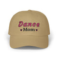 A khaki baseball cap featuring the embroidered text Dance Mom on the front. 