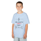 Young boy wearing a youth Gildan 5000B heavy cotton t-shirt in light blue with a Where Words Fail Music Speaks text and graphic