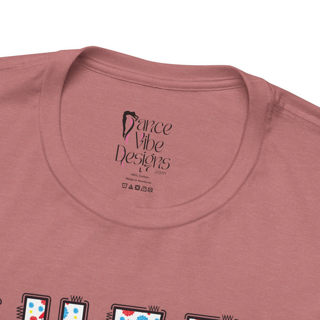 Close-up of a t-shirt's inner neck label with the brand Dance Vibe Designs printed above the care instructions.