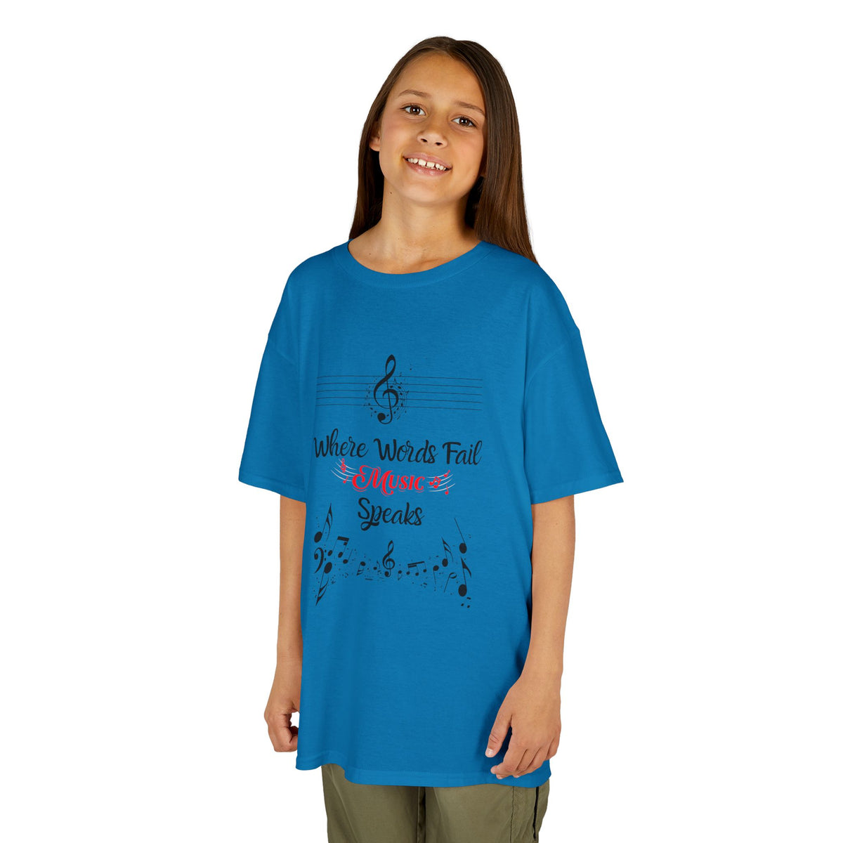 Young girl wearing a youth Gildan 5000B heavy cotton t-shirt in sapphire with a Where Words Fail Music Speaks text and graphic