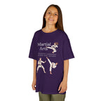 Young girl wearing a youth Gildan 5000B heavy cotton t-shirt in purple with a Martial Arts text and graphic