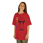 Young girl wearing a youth Gildan 5000B heavy cotton t-shirt in red with a Karate text and graphic