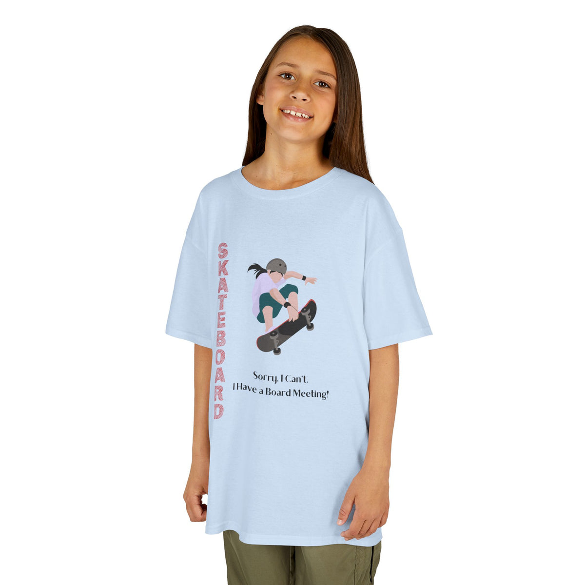 Young girl wearing a youth Gildan 5000B heavy cotton t-shirt in light blue featuring a girl Skateboarding