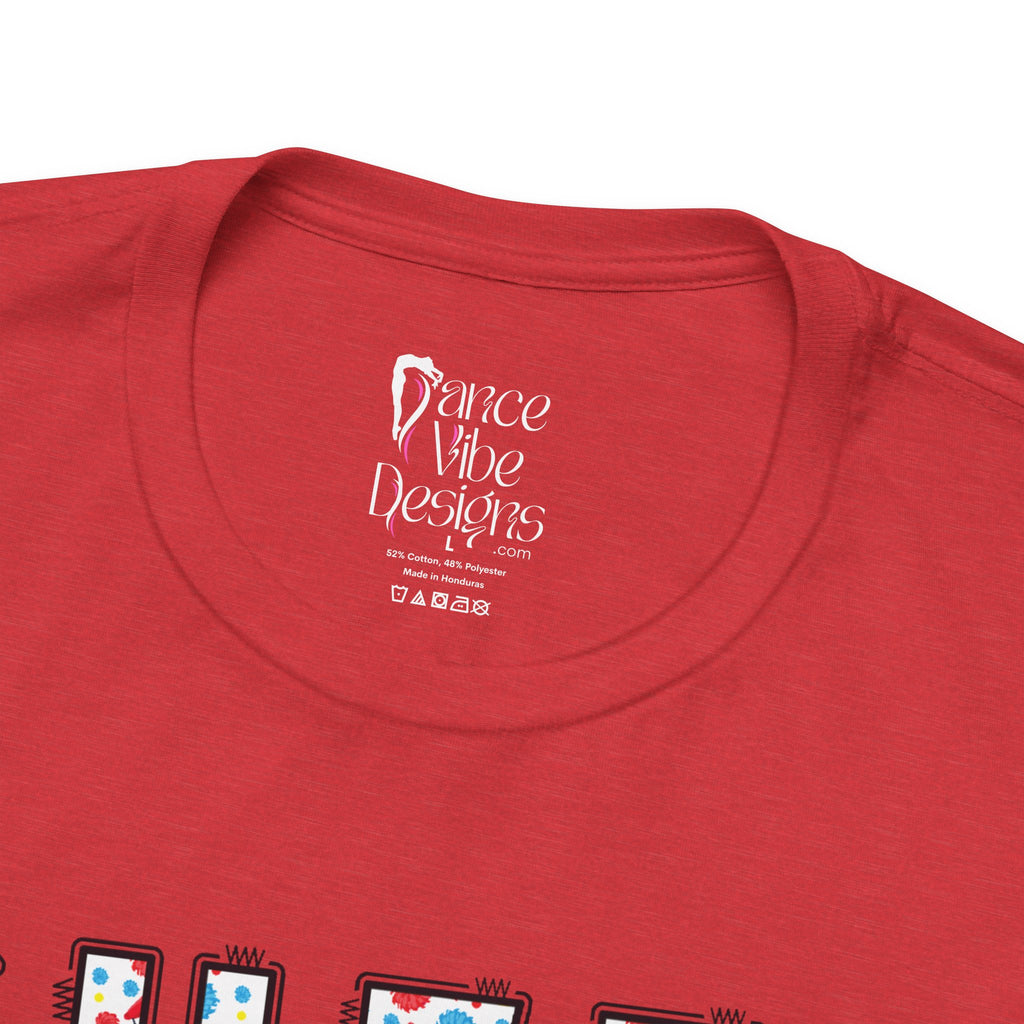 Close-up of a t-shirt's inner neck label with the brand Dance Vibe Designs printed above the care instructions.
