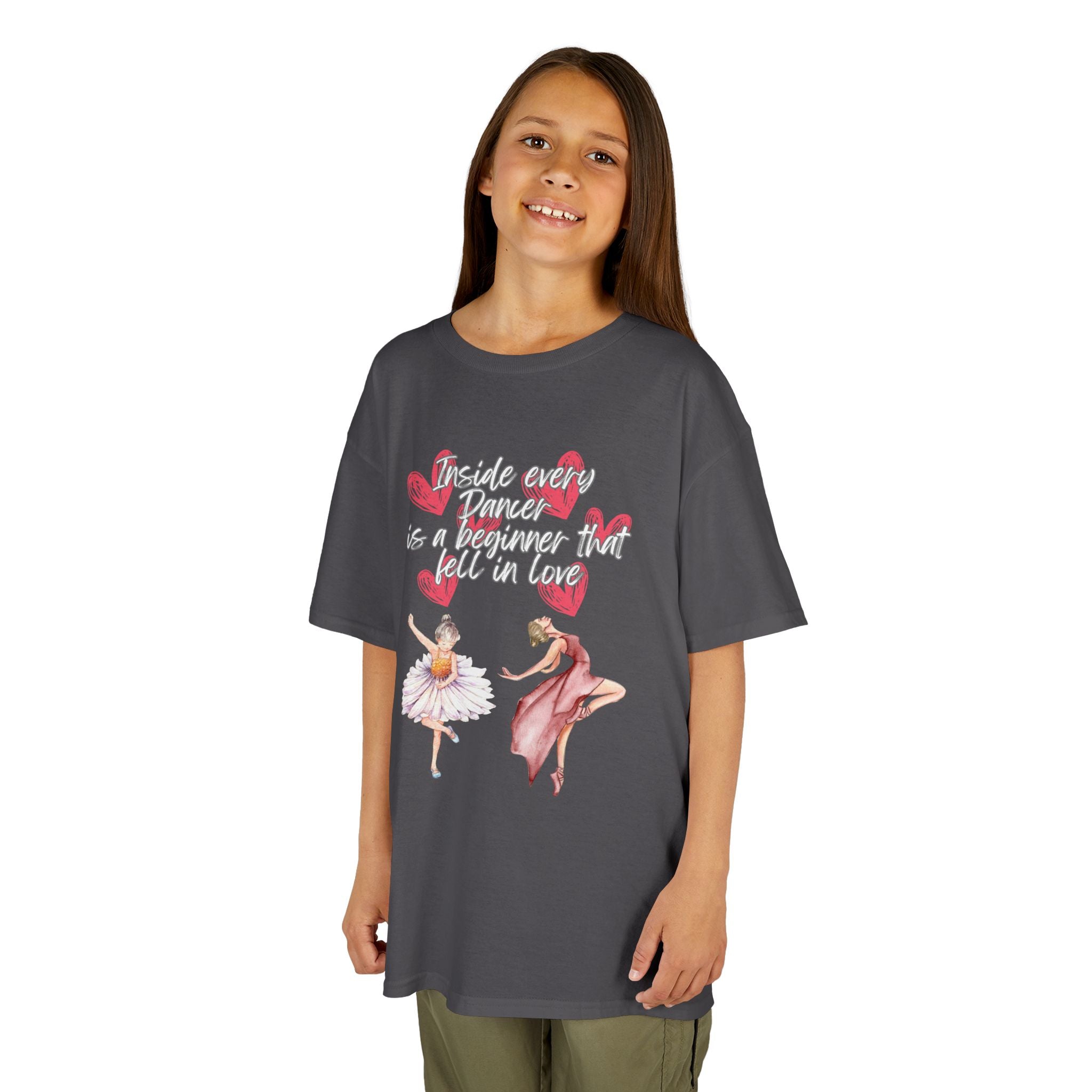 Young girl wearing a youth Gildan 5000B heavy cotton t-shirt in charcoal with an Inside Every Dancer is a Beginner that Fell in Love theme