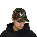Man wearing a camouflage cap with an embroidered deer graphic and The Hunt Is On text.
