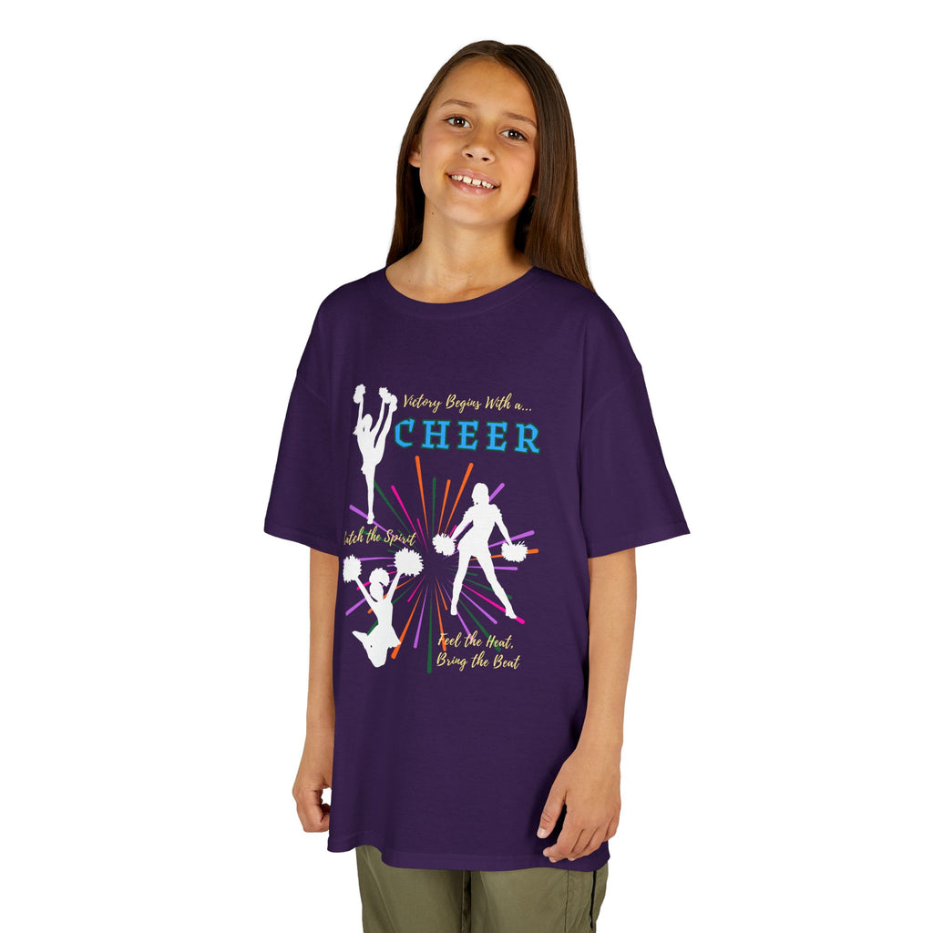 Young girl wearing a youth Gildan 5000B heavy cotton t-shirt in purple with a Cheer Team design