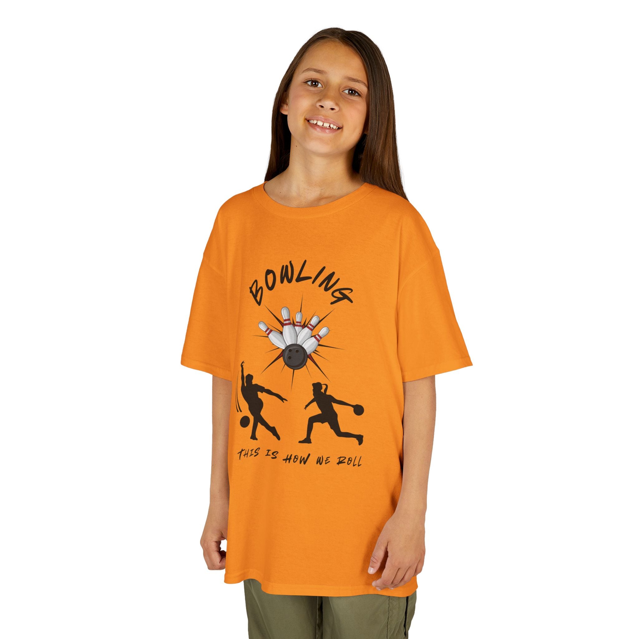 Young girl wearing a youth Gildan 5000B heavy cotton t-shirt in tennessee orange with a Bowling text and graphic