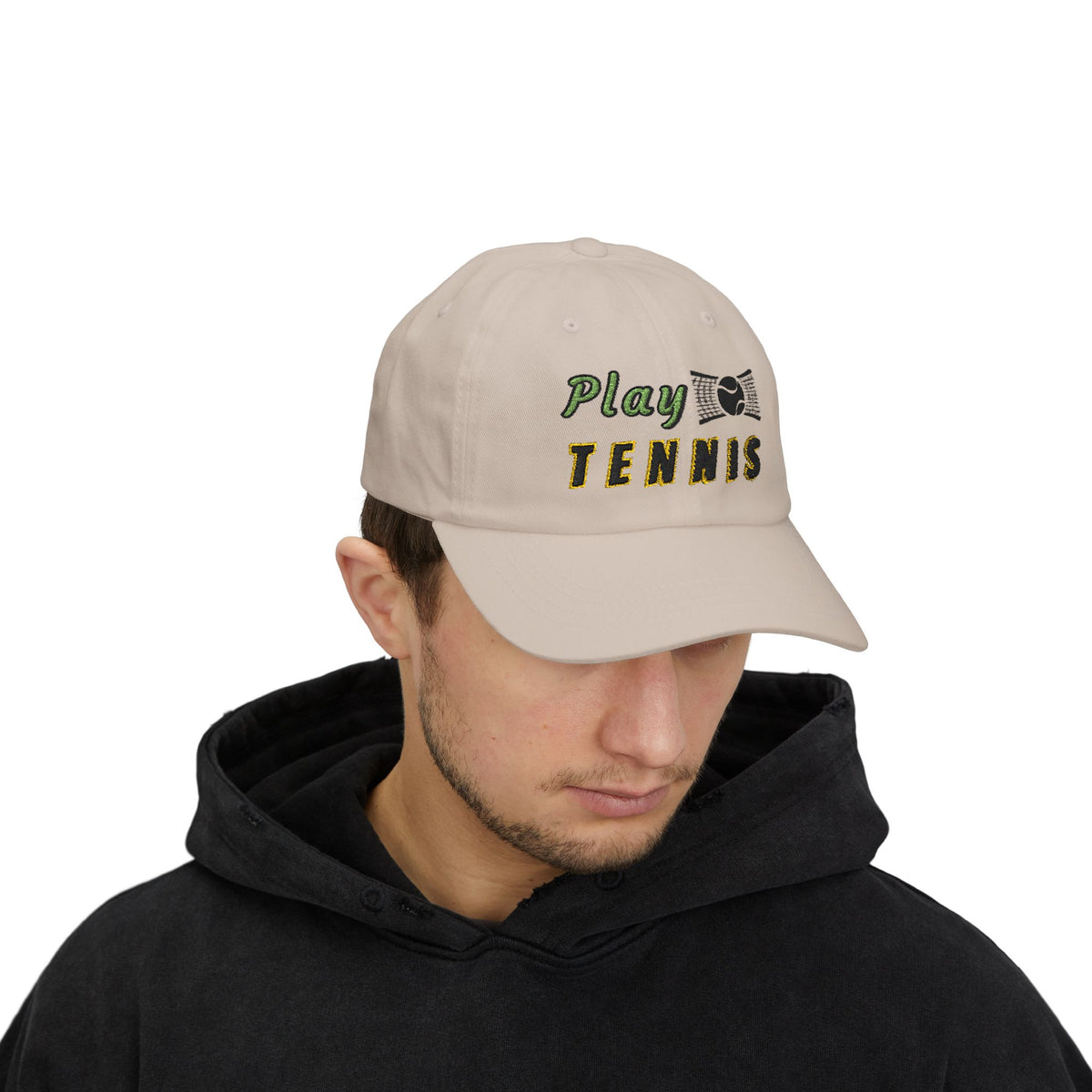 Man wearing a stone embroidered classic dad cap hat with a Play Tennis text and graphic