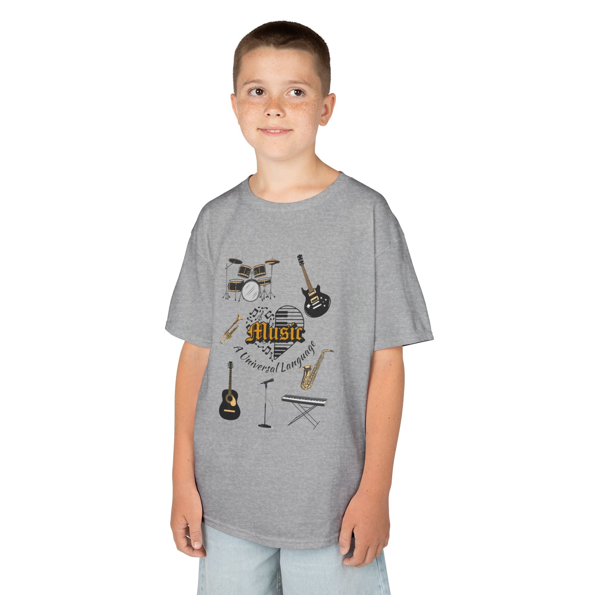 Young boy wearing a youth Gildan 5000B heavy cotton t-shirt in sport grey with a Music A Universal Language theme