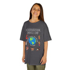 Young girl wearing a youth Gildan 5000B heavy cotton t-shirt in charcoal with an International Dance Day theme 