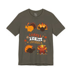 An army green short-sleeve t-shirt with a colorful Thanksgiving graphic featuring cartoon turkeys and the text GOBBLE TIL YOU WOBBLE.