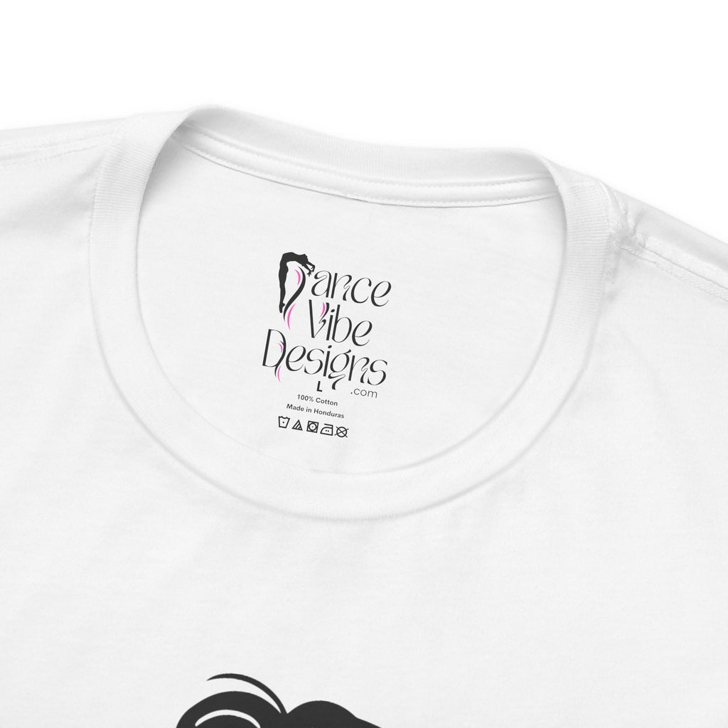 Close-up of a t-shirt's inner neck label with the brand Dance Vibe Designs showing above the care instructions.