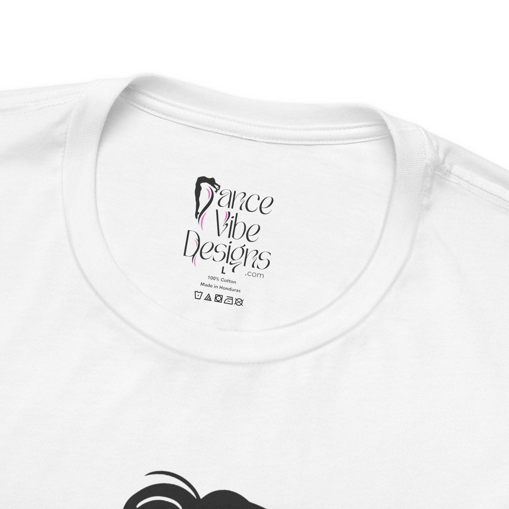 Close-up of a t-shirt's inner neck label with the brand Dance Vibe Designs showing above the care instructions.