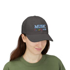 Woman wearing a dark grey cap with an embroidered MUSIC IS LIFE text and musical notes graphic.