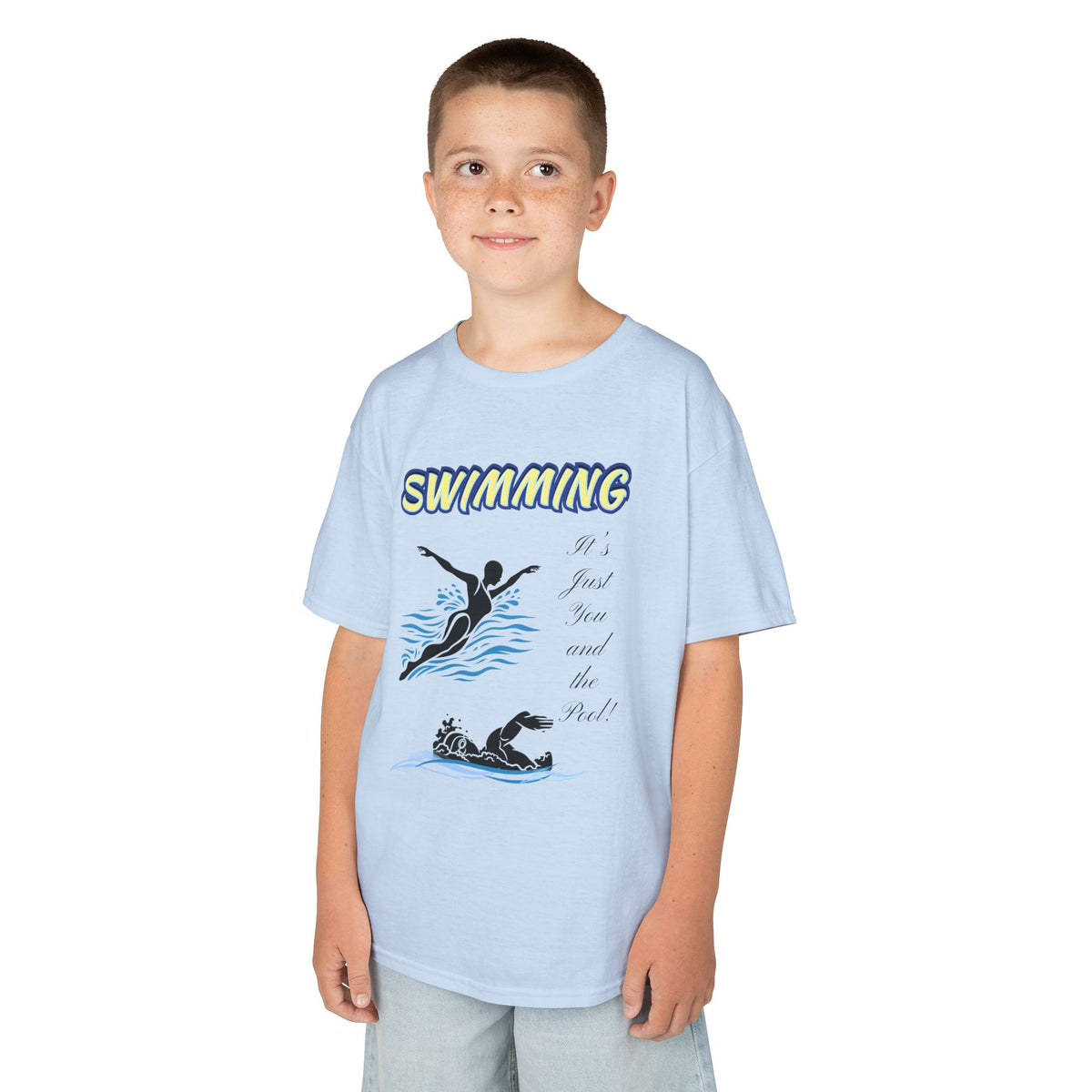 Young boy wearing a youth Gildan 5000B heavy cotton t-shirt in light blue with a Swimming text and graphic