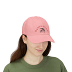 Woman wearing a pink embroidered classic dad cap hat with a Gymnastics text and graphic 