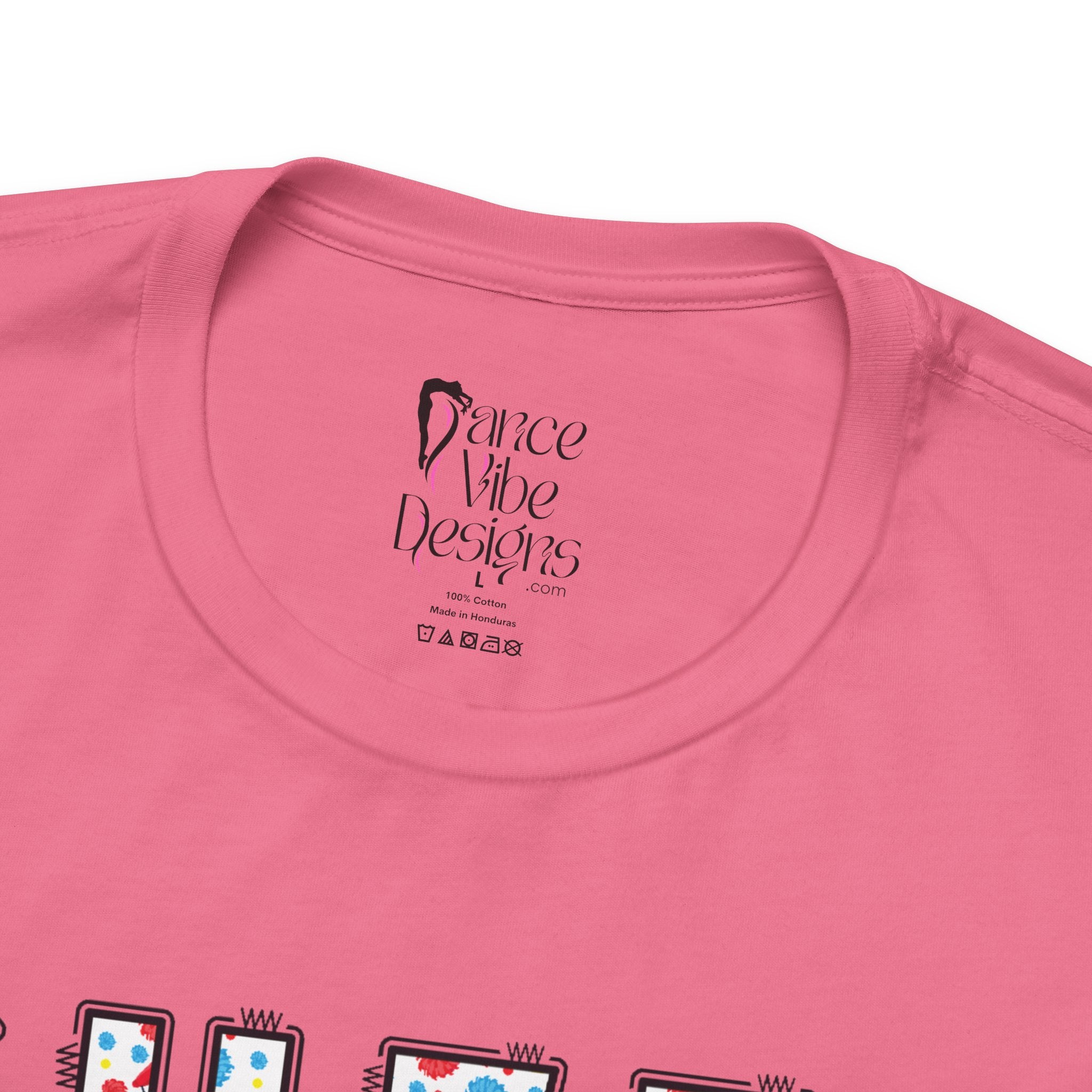 Close-up of a t-shirt's inner neck label with the brand Dance Vibe Designs printed above the care instructions.