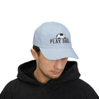 Man wearing a light blue cap with an embroidered soccer ball and Play Ball text on the front.