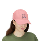 Woman wearing a pink embroidered classic dad cap hat with a Hockey text and graphic