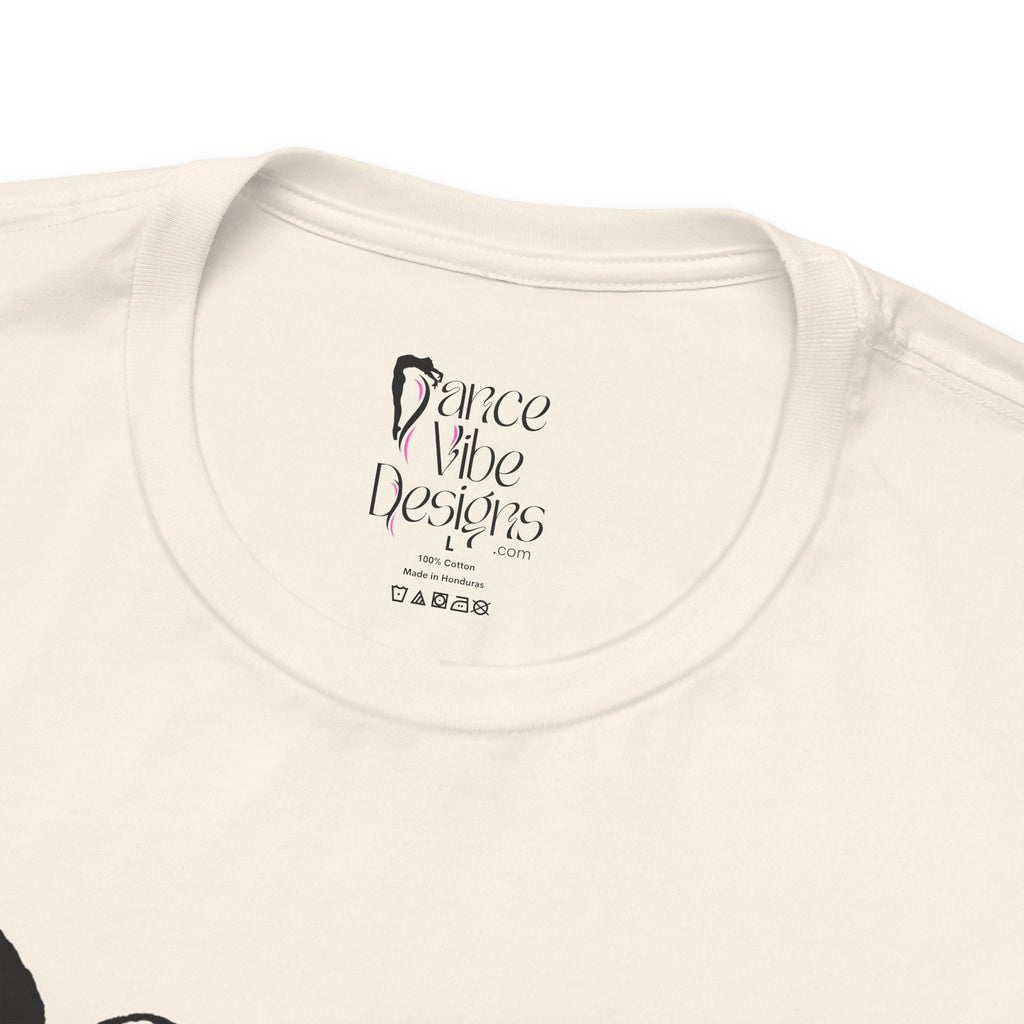 Close-up of a crewneck t-shirt showing the inner neck label with the brand Dance Vibe Designs printed above the care instructions.