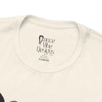 Close-up of a crewneck t-shirt showing the inner neck label with the brand Dance Vibe Designs printed above the care instructions.