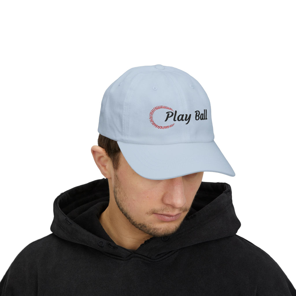 Man wearing a light blue embroidered classic dad cap hat with Play Ball text and baseball graphic