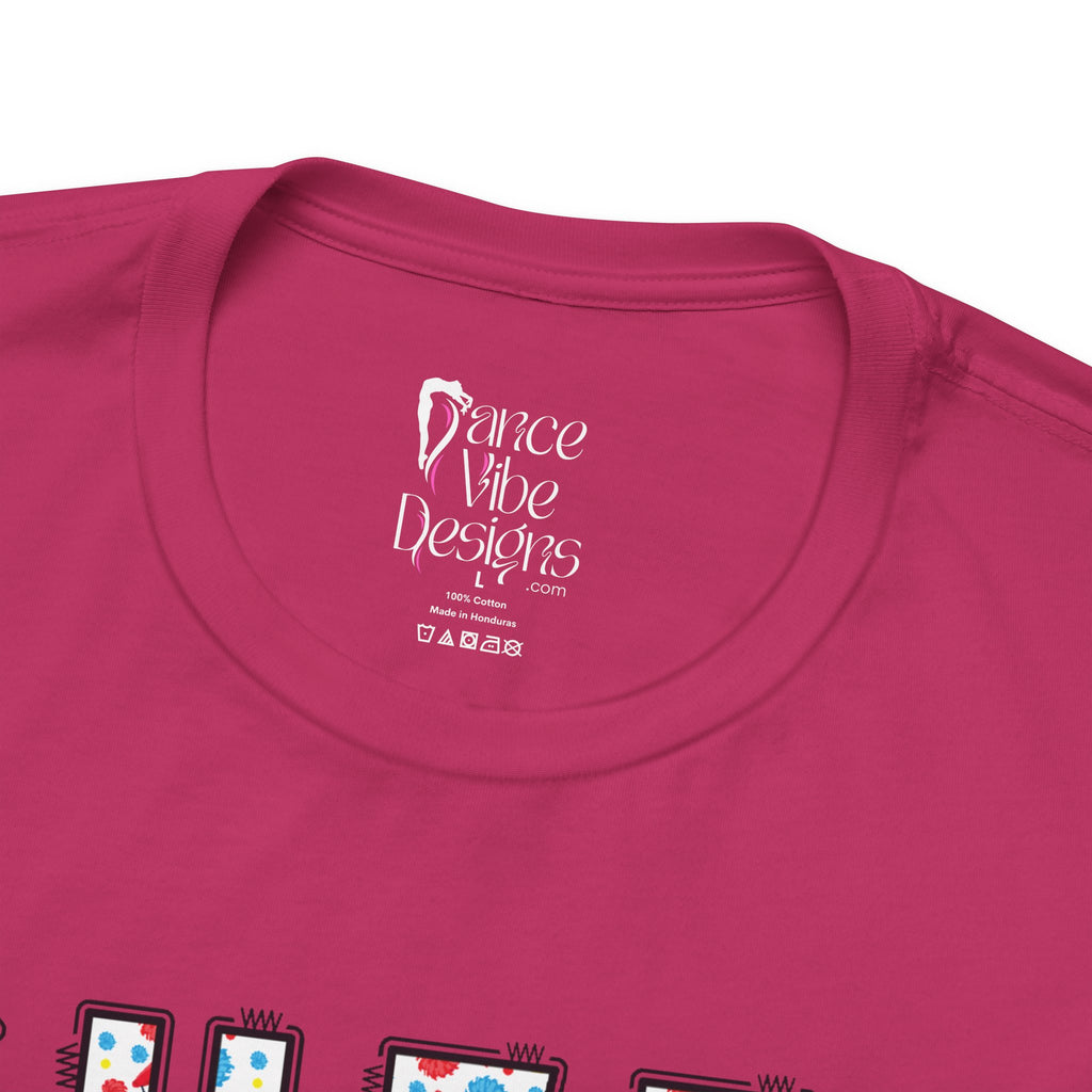Close-up of a t-shirt's inner neck label with the brand Dance Vibe Designs printed above the care instructions.