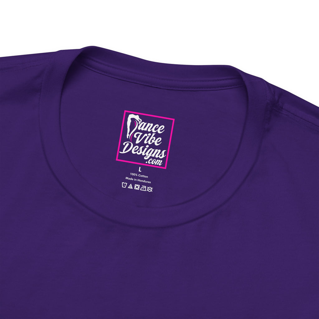 Close up view of a Dance Vibe Designs custom neck label above t-shirt care instructions.