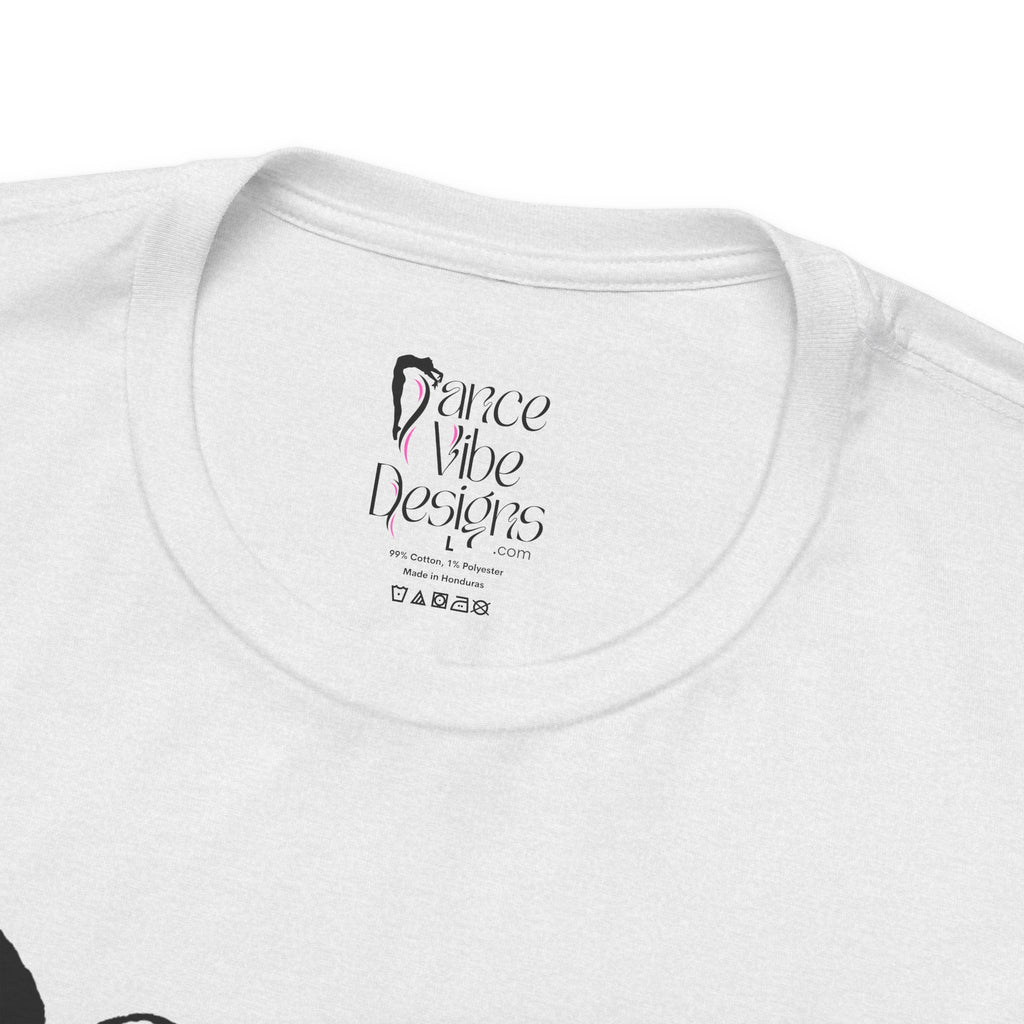 Close-up of a crewneck t-shirt showing the inner neck label with the brand Dance Vibe Designs printed above the care instructions.