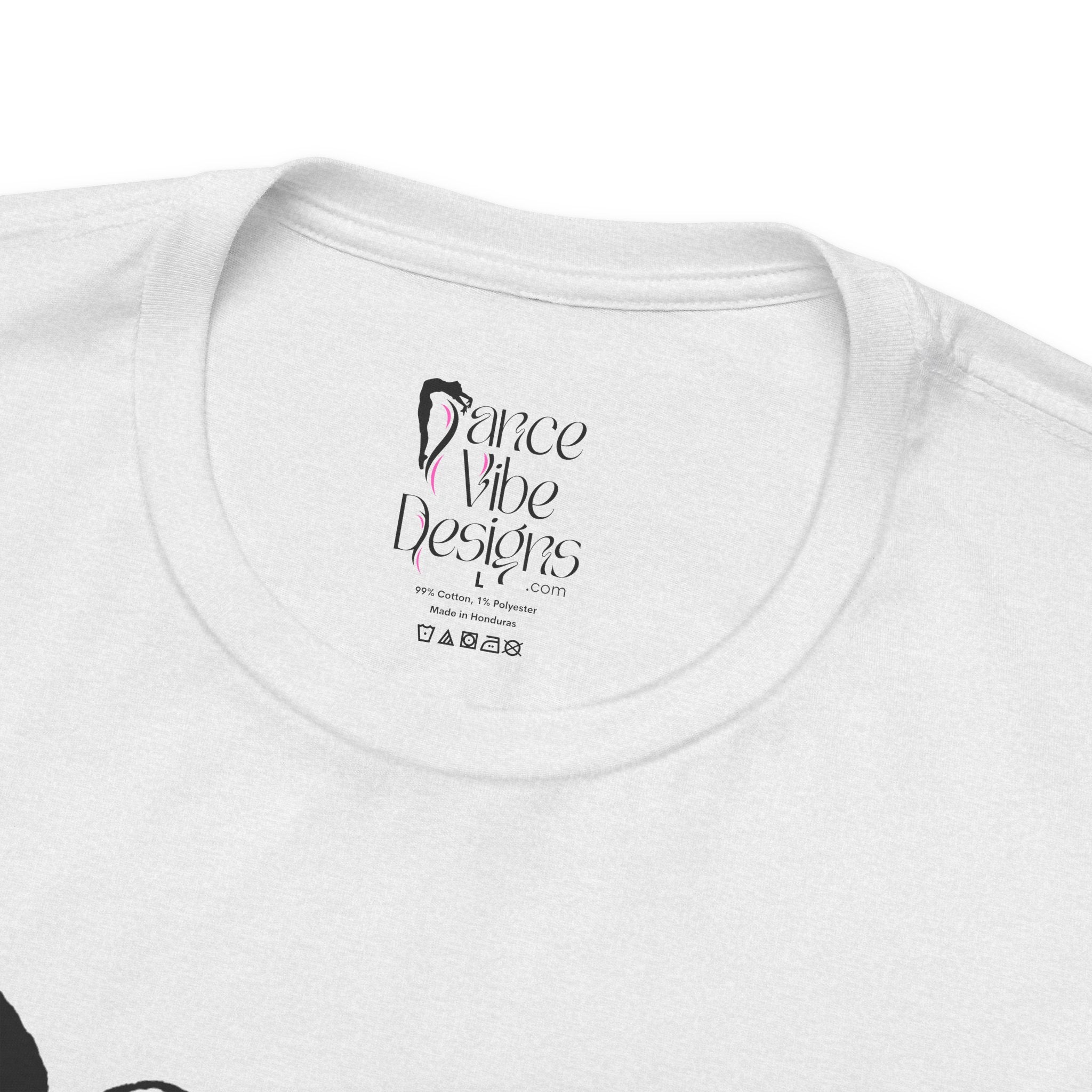 Close-up of a crewneck t-shirt showing the inner neck label with the brand Dance Vibe Designs printed above the care instructions.