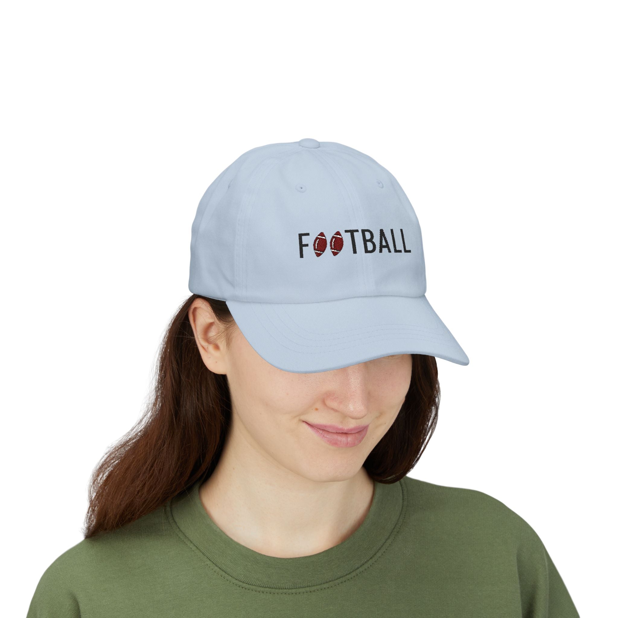 Woman wearing a light blue embroidered classic dad cap hat with Football text and graphic