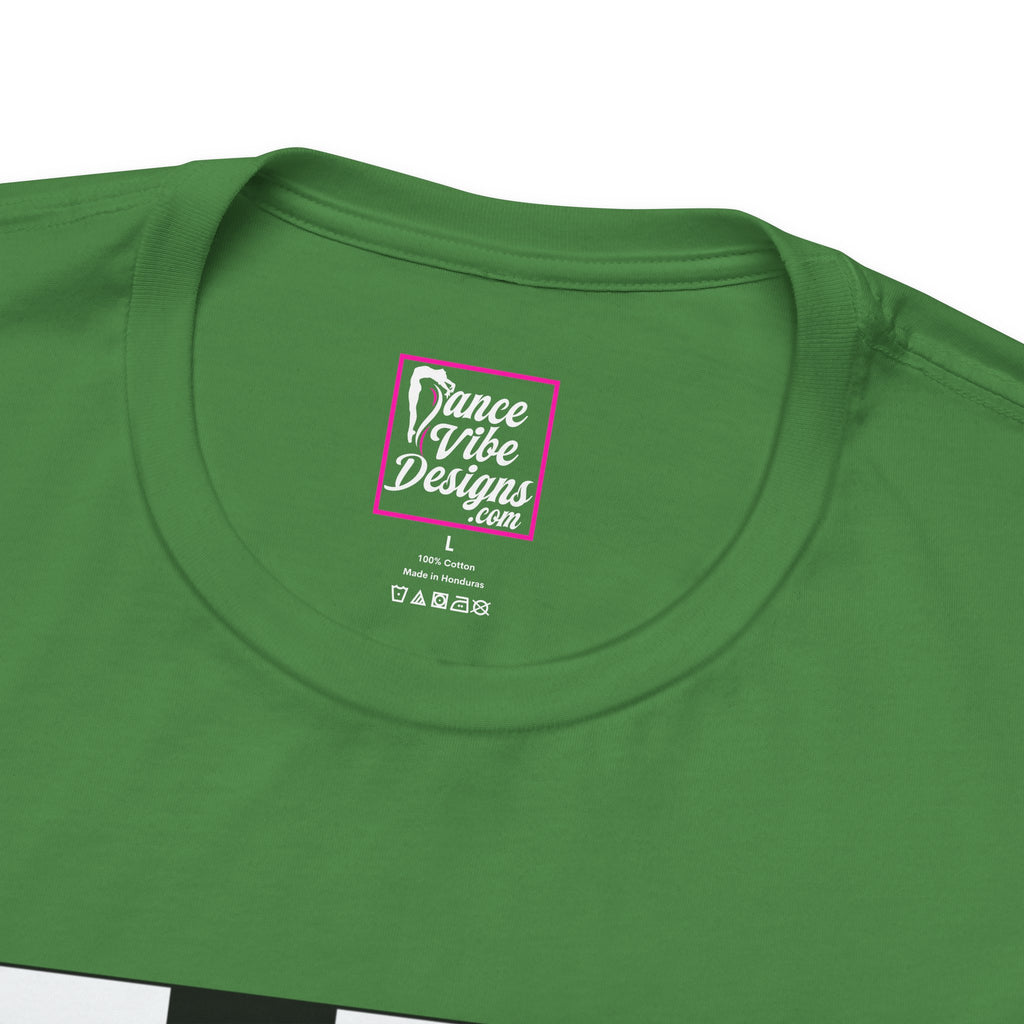 Close up view of a custom Dance Vibe Designs neck label shown above the t-shirt care instructions.