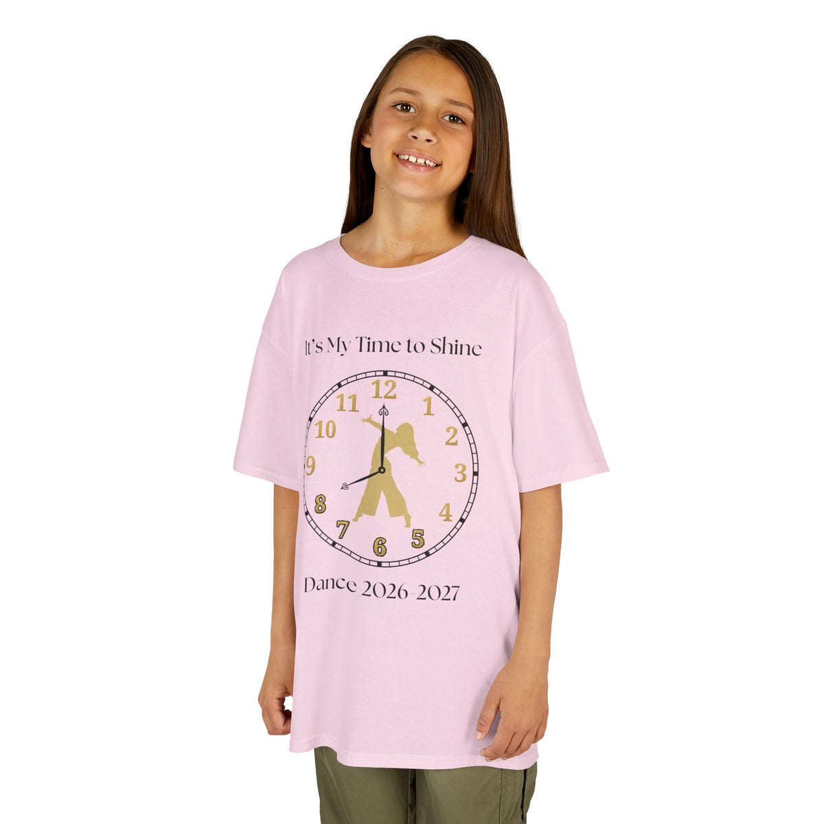 Young girl wearing a youth Gildan 5000B heavy cotton t-shirt in light pink with an It's My Time to Shine Contemporary Dance 2026-2027 theme