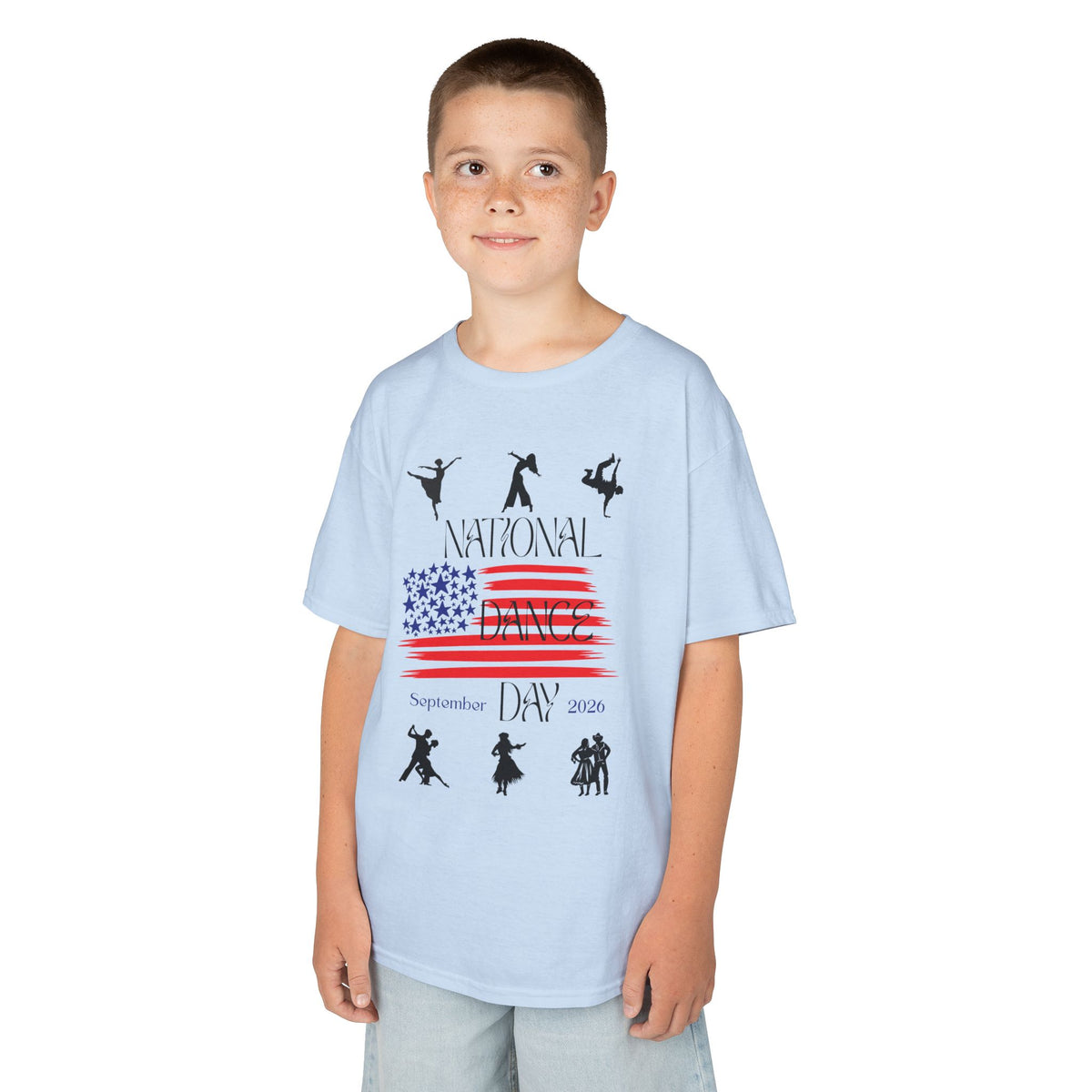 Young boy wearing a youth Gildan 5000B heavy cotton t-shirt in light blue with a National Dance Day theme