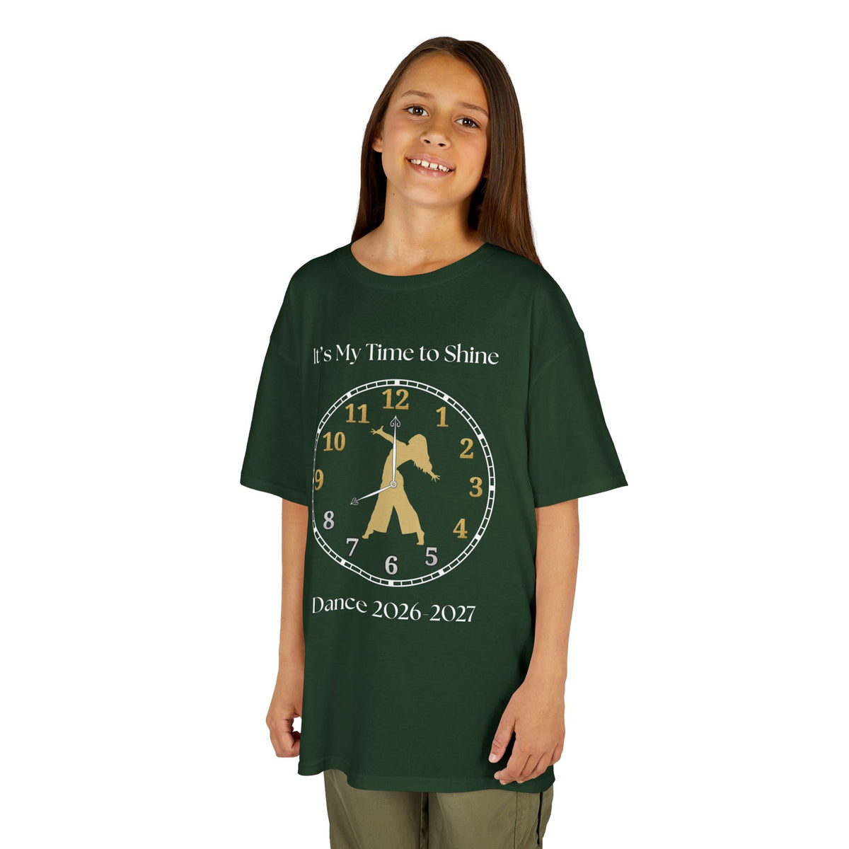 Young girl wearing a youth Gildan 5000B heavy cotton t-shirt in forest green with an It's My Time to Shine Contemporary Dance 2026-2027 theme
