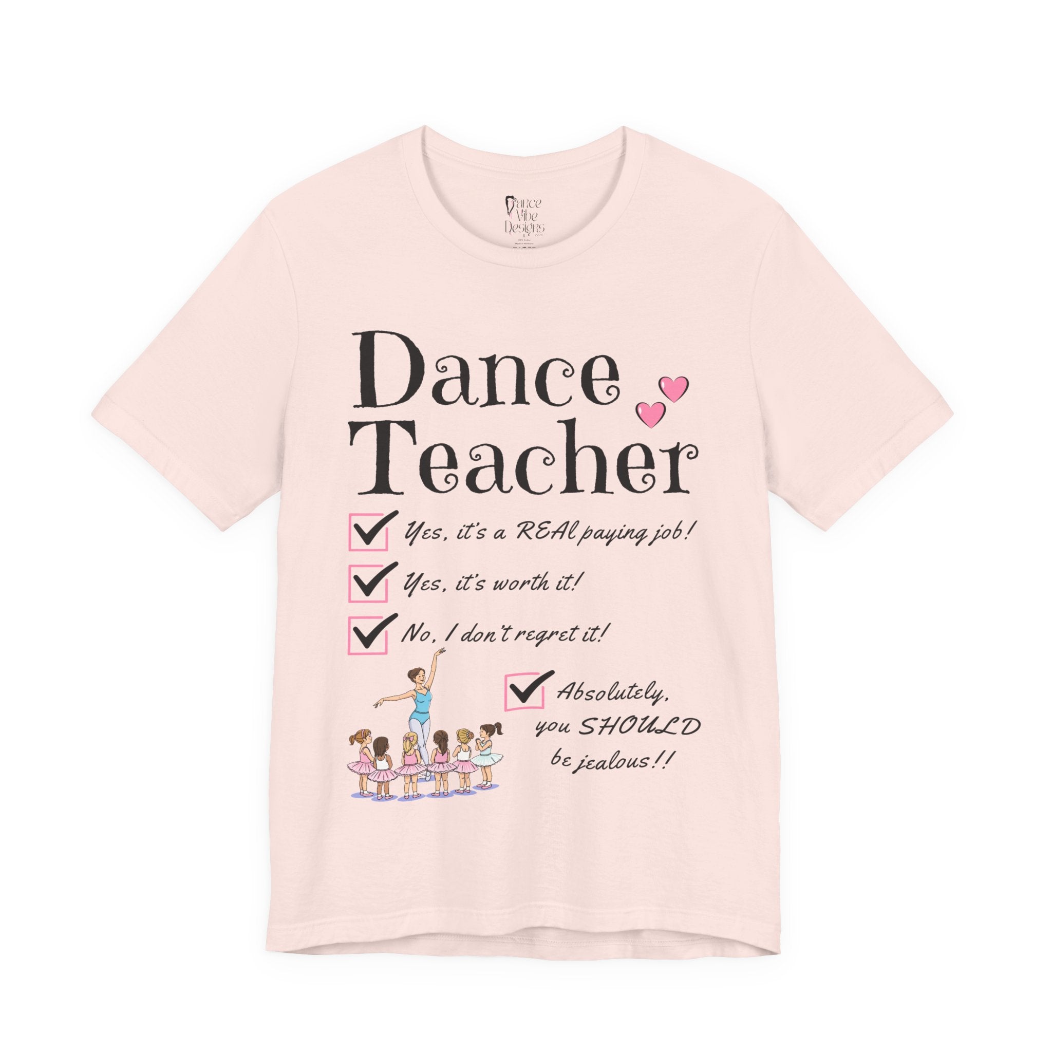 A soft pink short-sleeve crewneck t-shirt featuring a text that reads Dance Teacher and a ballet class graphic.