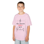 Young boy wearing a youth Gildan 5000B heavy cotton t-shirt in light pink with a Where Words Fail Music Speaks text and graphic